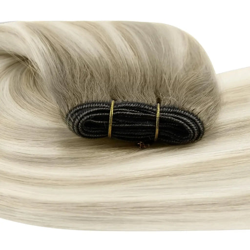 High-quality human hair weft extensions in multiple shades, perfect for adding volume and length