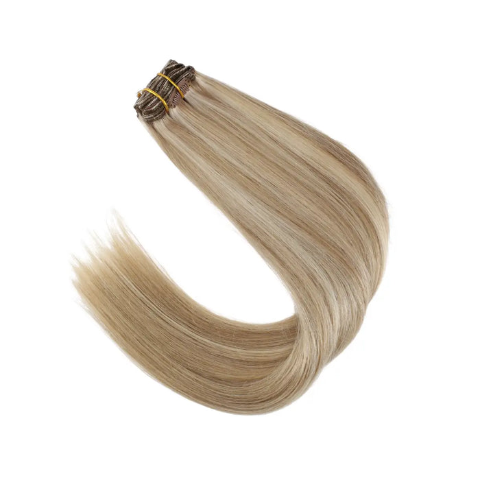 Clip-in hair extensions, Remy human hair, light brown to light blonde blend, long and voluminous, easy to attach, reusable, straight, wavy, natural-looking, seamless, salon-quality, hair length extensions, temporary hair lengthening, thickening, hair styling, DIY hairstyle, premium hair extensions, lightweight and comfortable.